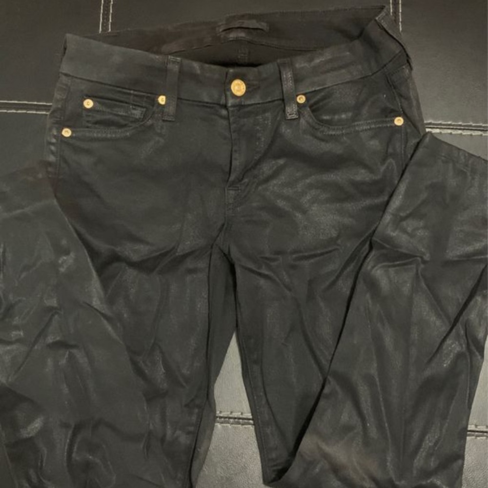 Shiny black pants with gold accents